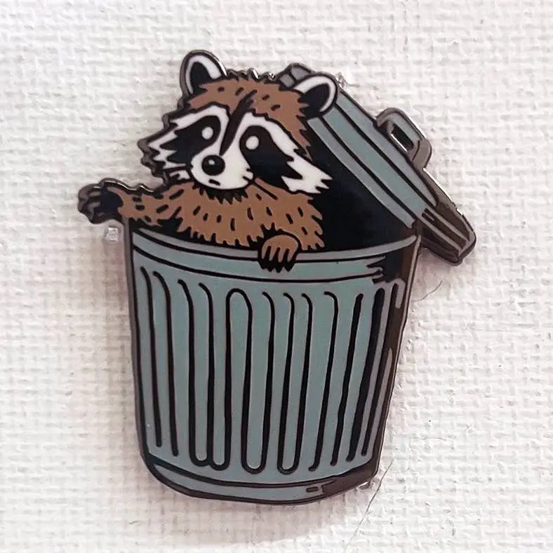 Raccoon in Trash Enamel Pin – Playfully Chaotic Wildlife Design