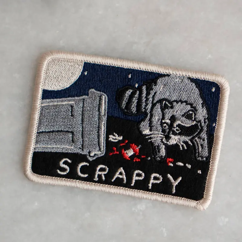 Scrappy Raccoon Trash Patch – Quirky Recycled-Aesthetic Appliqué